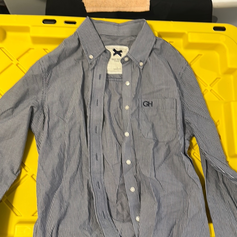 GH . Blue and white striped shirt.